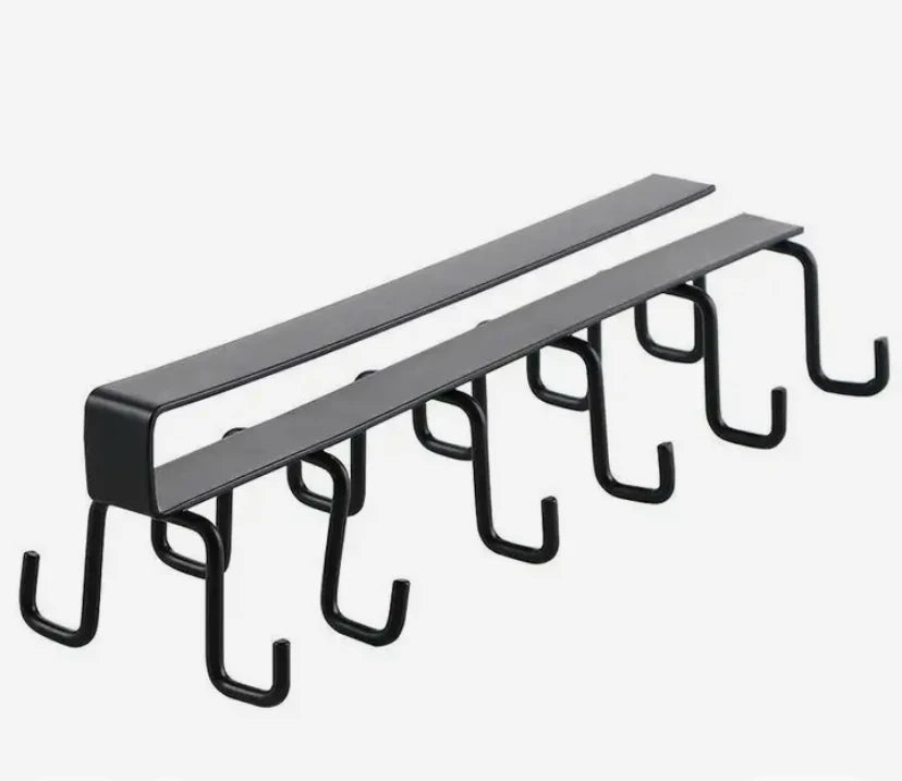 Metal hook rack with multiple hooks on a white background