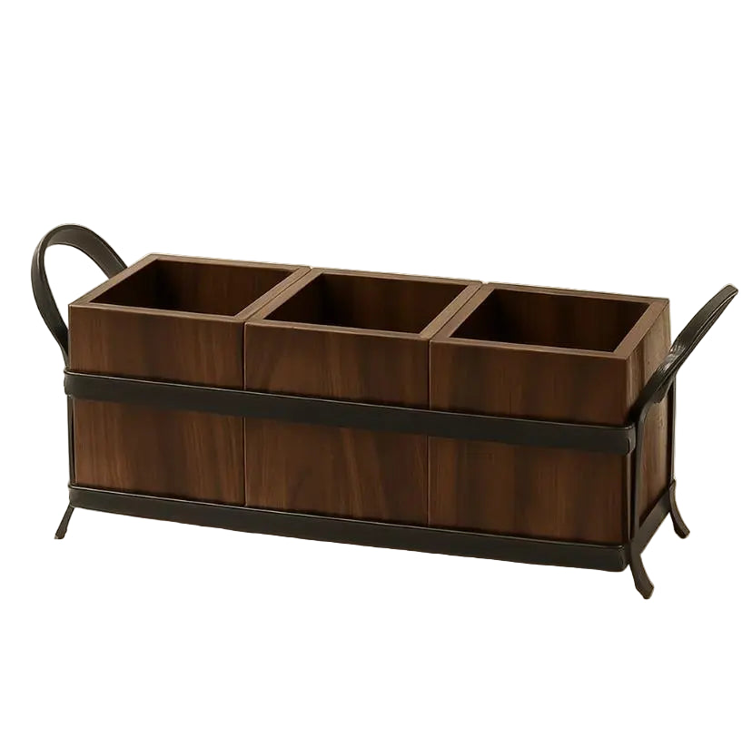 Wooden tray with three compartments and metal handles on a beige background