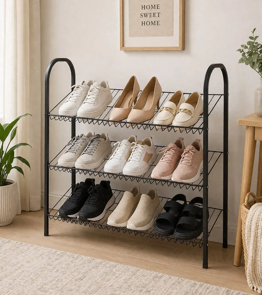 3-tier black metal shoe rack with three wire shelves holding shoes in a modern home entryway