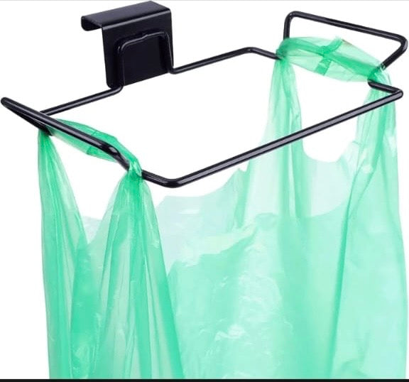 Over the cabinet door trash bag holder for kitchen waste organization.